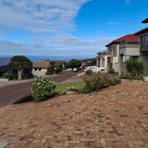VZ Self Catering: a brick driveway in front of a house