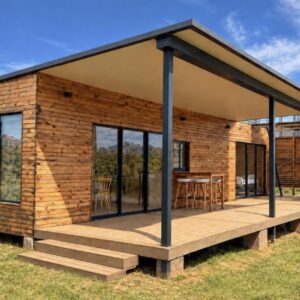 Waterfall Farm Self-Catering Cottages Citrusdal: a tiny house with a deck in a field