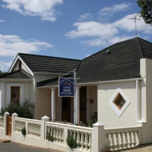 Wheatlands Lodge: a white house with a black roof